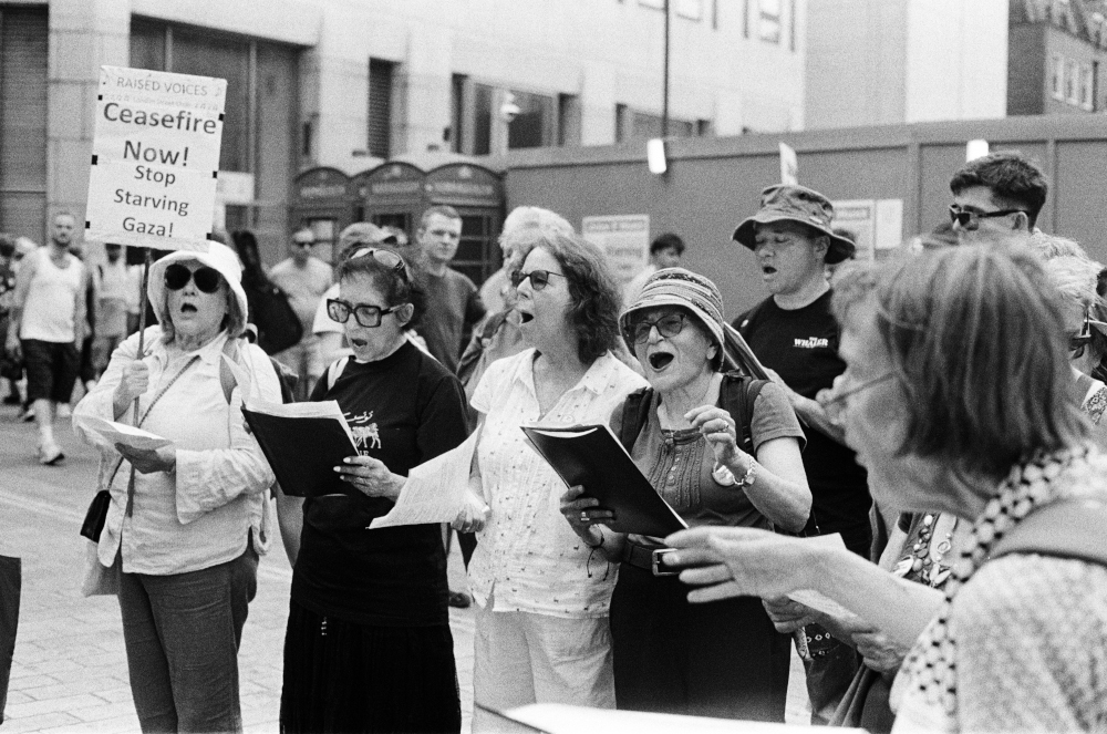 Raised Voices singing in support of Palestine in June 2025